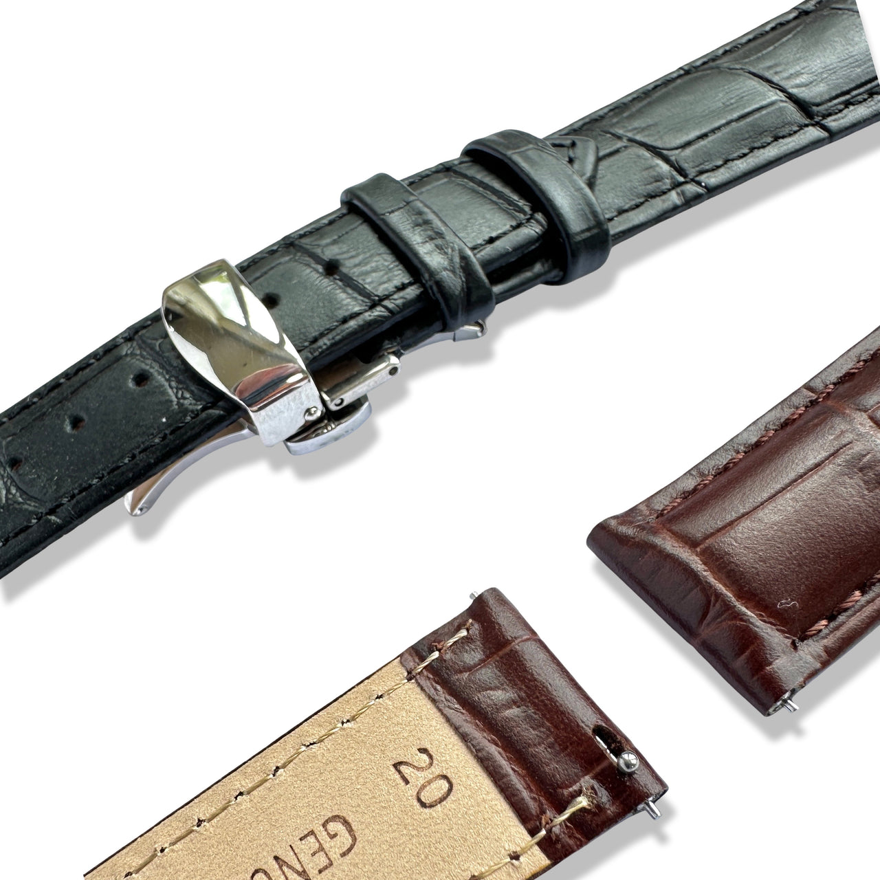 Black and brown leather watch straps with metal buckles on a white background