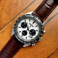 Thumbnail for Seiko watch with brown leather strap on a wooden surface
