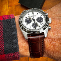 Thumbnail for Seiko watch on a wrist with a wooden surface in the background